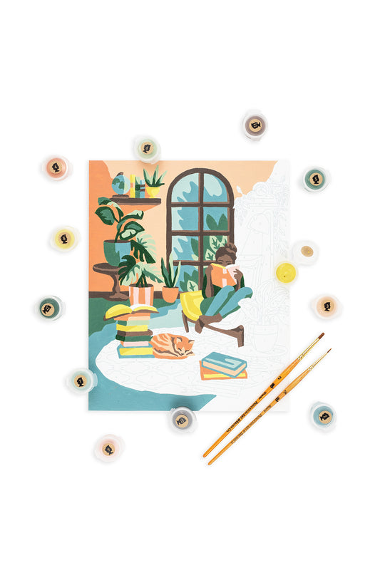 A Novel Afternoon | Booklovers Paint-by-Number Kit half painted with paints and brushes displayed.