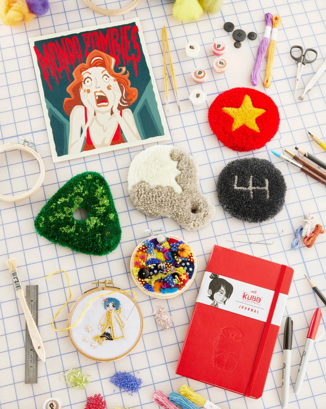 The Mondo Zombies paint-by-number kit laying among other craft kits from the Laika Shop.