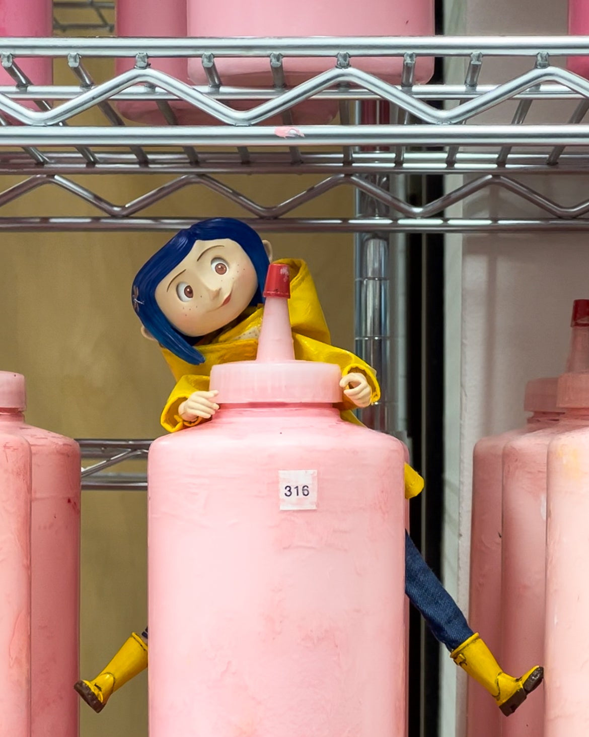 Coraline doll in the Elle Crée paint room.