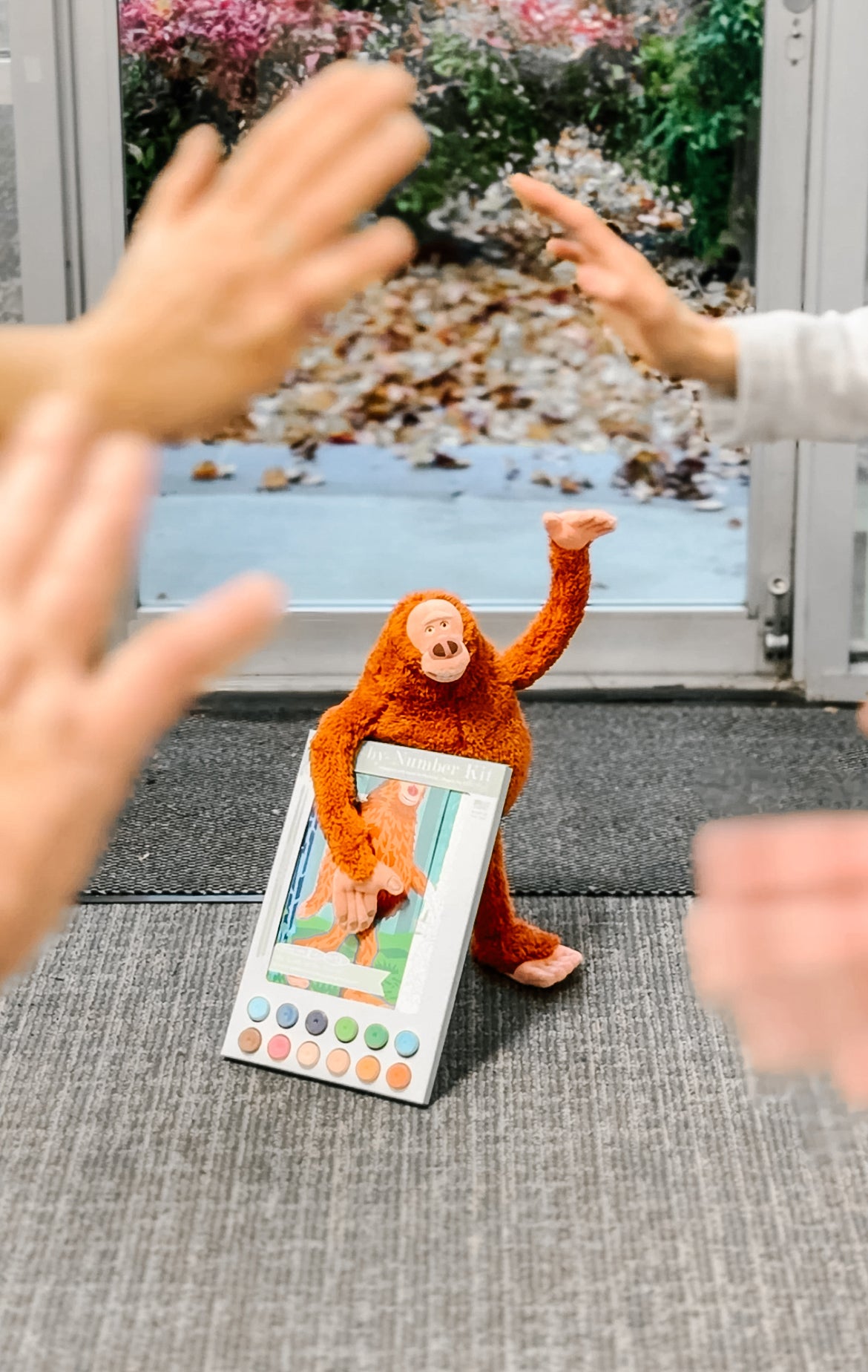 Mr. Link plushie from Laika's Missing Link visits the Elle Crée workshop to check on the Missing Link paint-by-number kit.