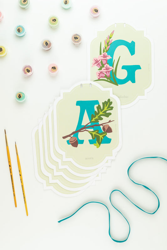 Paint-by-Number banner kit cards that read "A" and "G" from the "Gather" banner kit.