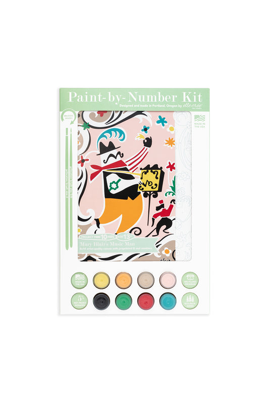 Mary Blair’s Music Man paint-by-number kit packaging featuring organ grinder and monkey artwork, 8 acrylic paint pots, and brushes.