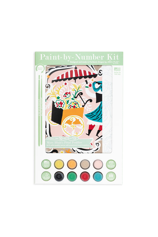 Mary Blair’s Petal Peddler paint-by-number kit featuring a cheerful flower cart with blooms, striped umbrella, 8 acrylic paint colors, and brushes.