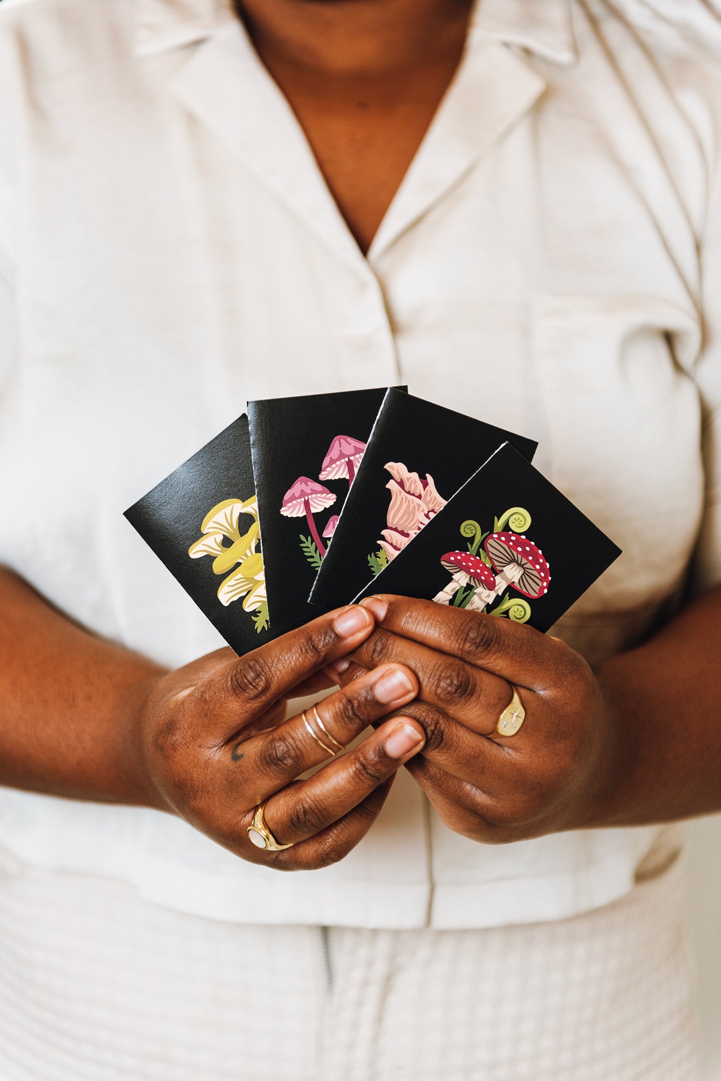 The Mushrooms on Black Mini Gift Card set includes Fly Agaric, Pink Oyster, Bleeding Fairy Helmet, and Golden Oyster mushrooms. 